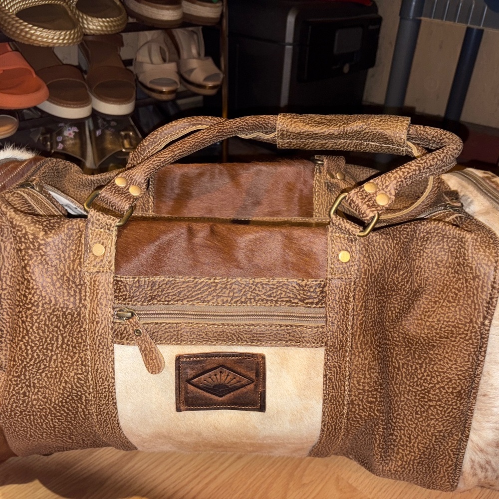 Cowhide Myra duffle bag